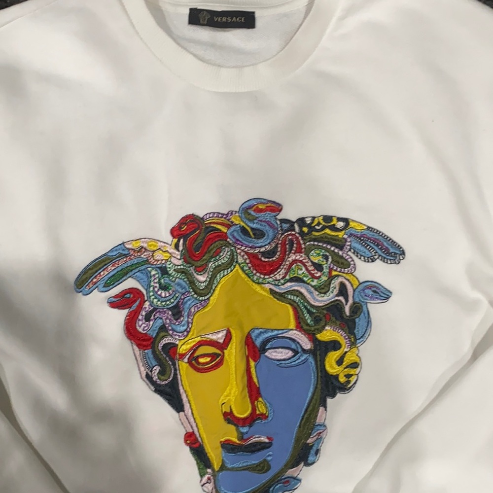 Versace multicolored Medusa sweater.